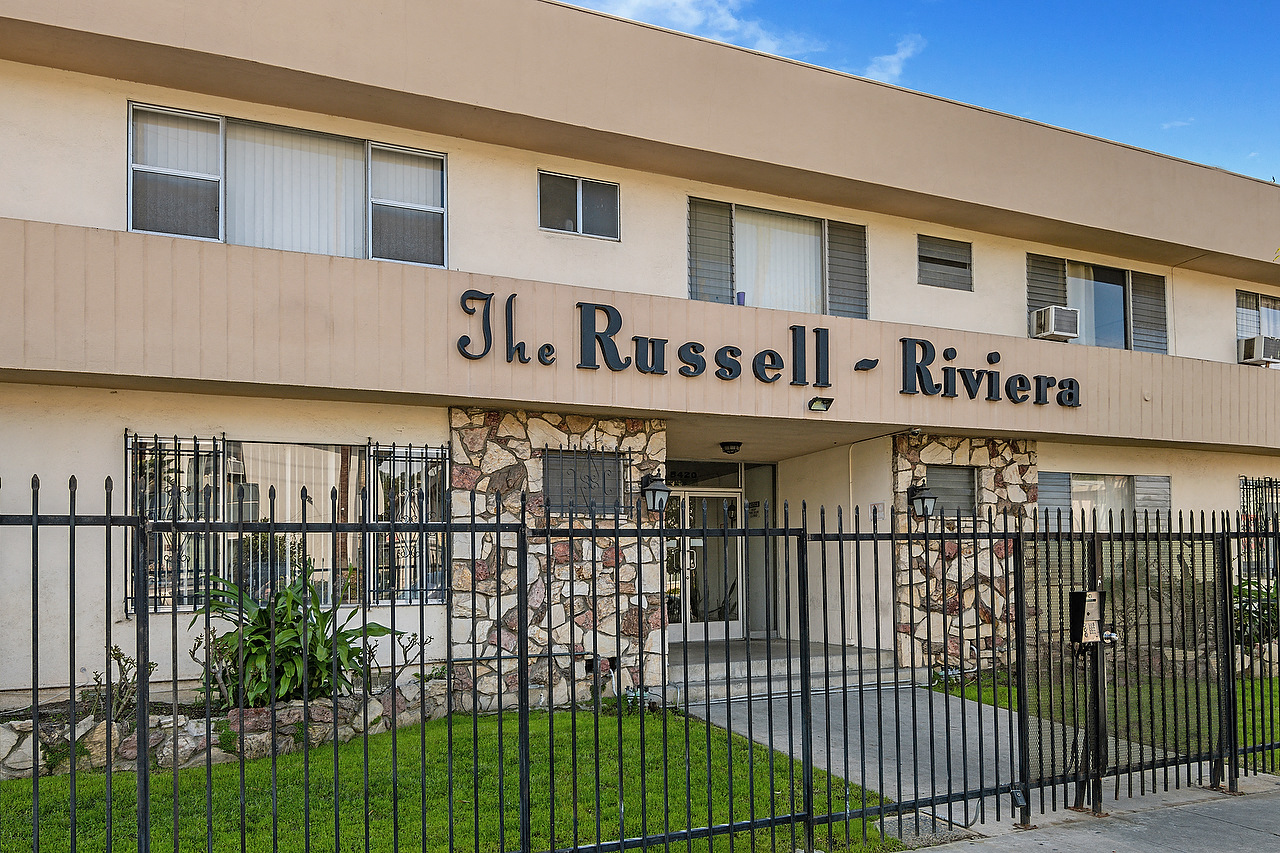 the russell rivera building with a gate in front of it